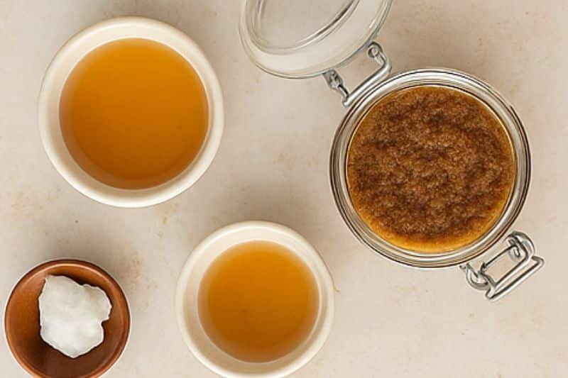 DIY beauty flat lay with brown sugar, coconut oil, and scrub in jar